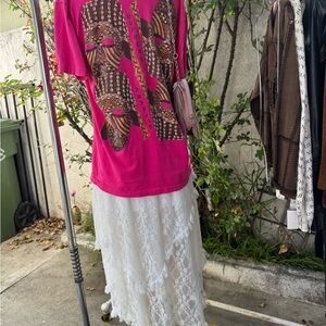 Supreme Pink Graphic Tee Over White Lace Maxi Skirt
